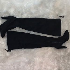Over the knee high black heeled boots